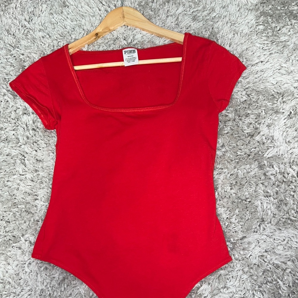A body suit from Victoria’s Secret pink, color red, in size medium